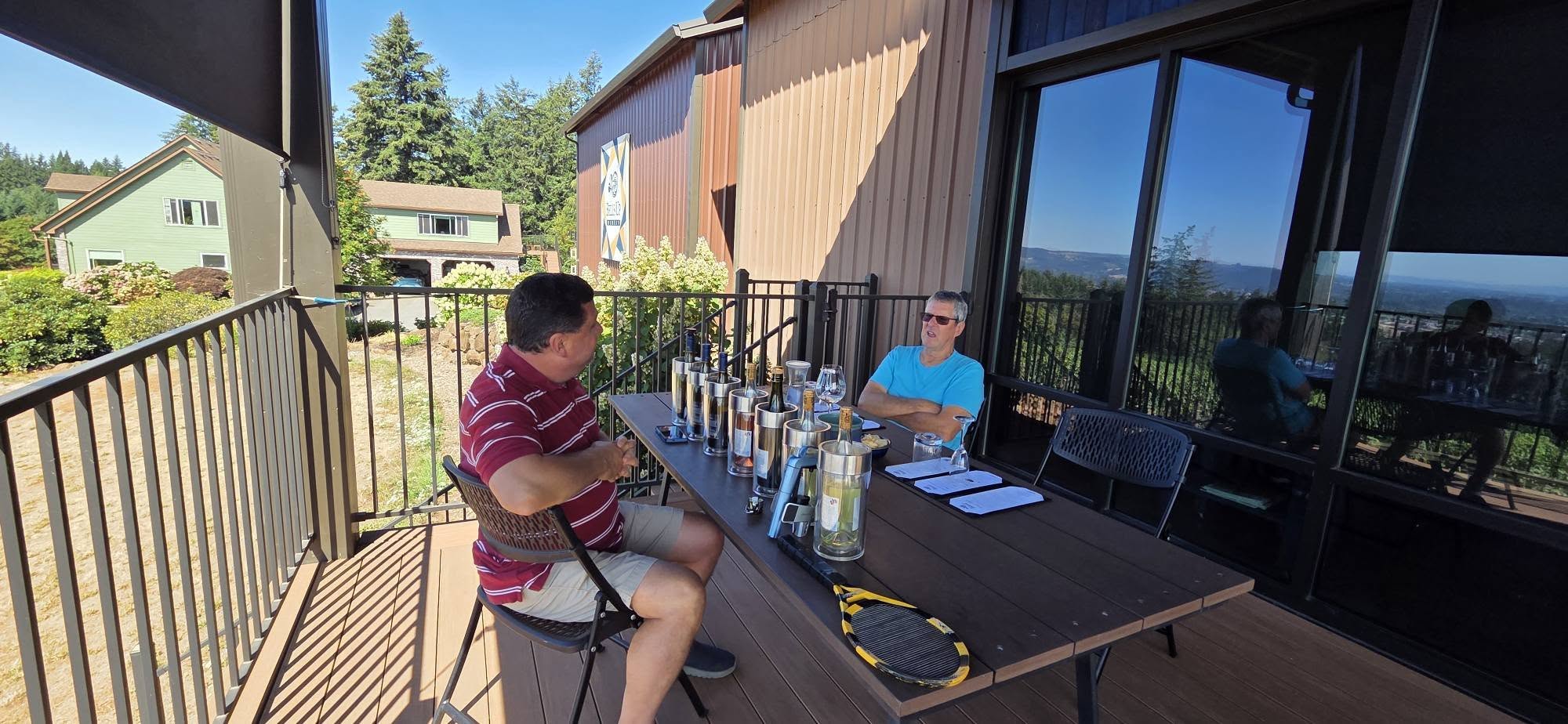 Dave and Peepaw chatting at the tasting table on the deck